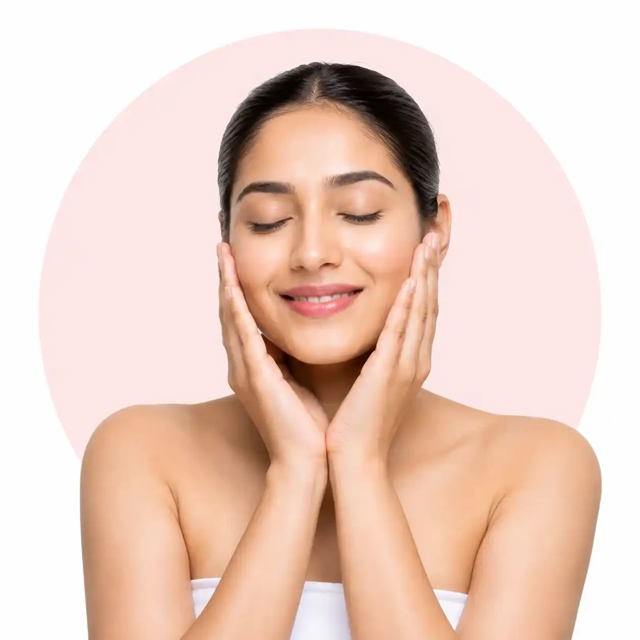 Beautician massaging a de tan and bleach facial cream into a client’s face and neck