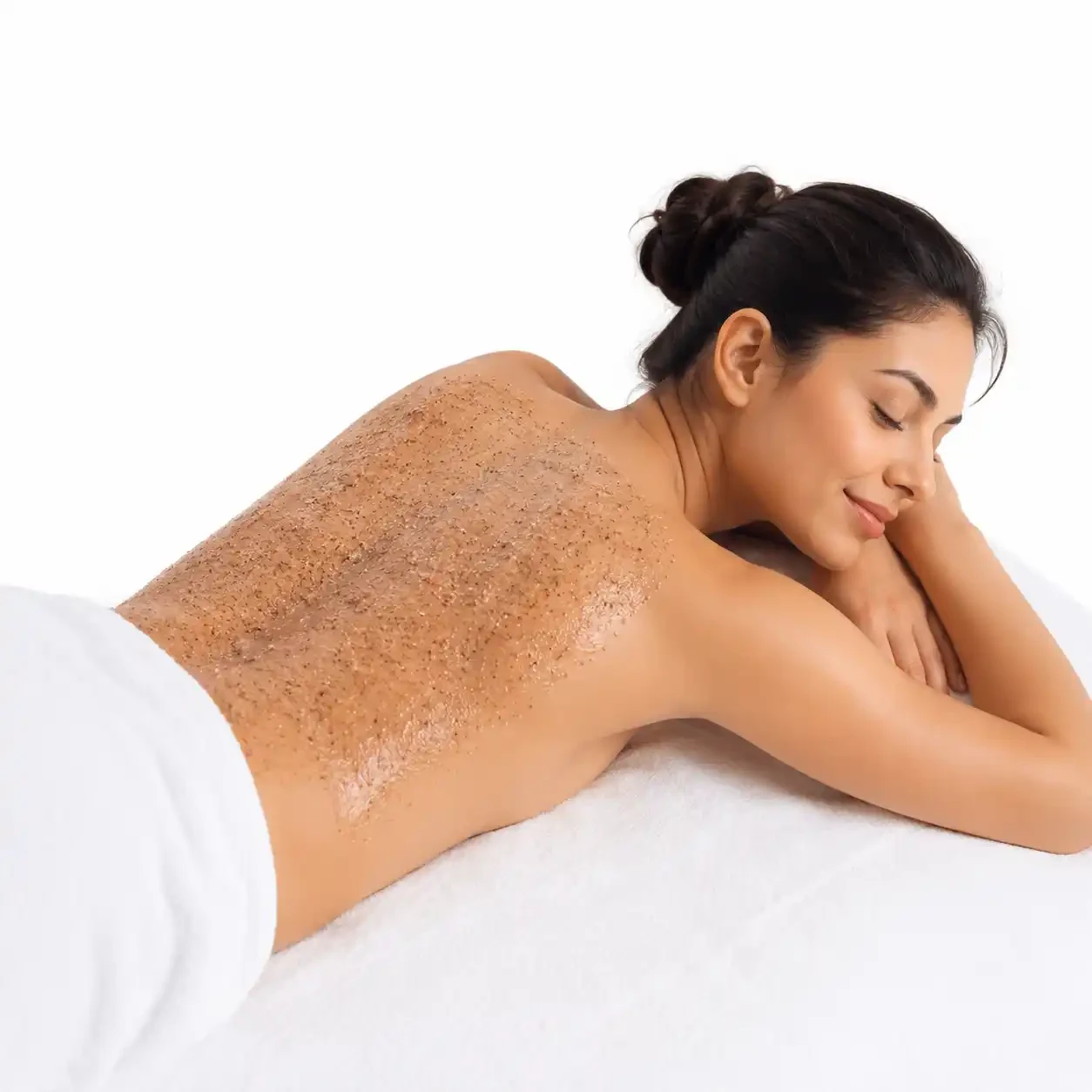 Body polishing scrub and de tan products laid out for a home body care appointment